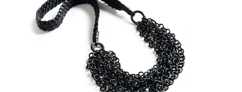 Braided Waterfall: Multi strand black buffalo horn necklace. Braided Nappa leather band.