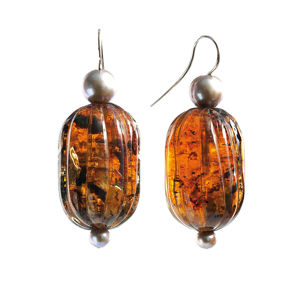 Carved Dominican amber earrings with fresh water pearls.