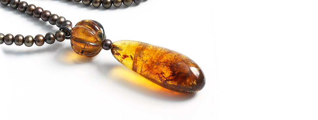 Honey Drop necklace: Droped shaped Dominican amber pendant, fresh water pearls sautoir.