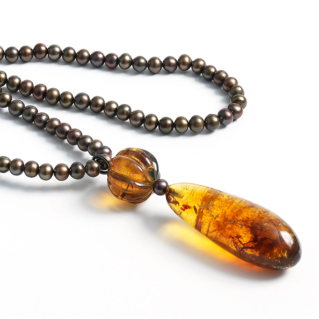 Honey Drop necklace: Droped shaped Dominican amber pendant, fresh water pearls sautoir.