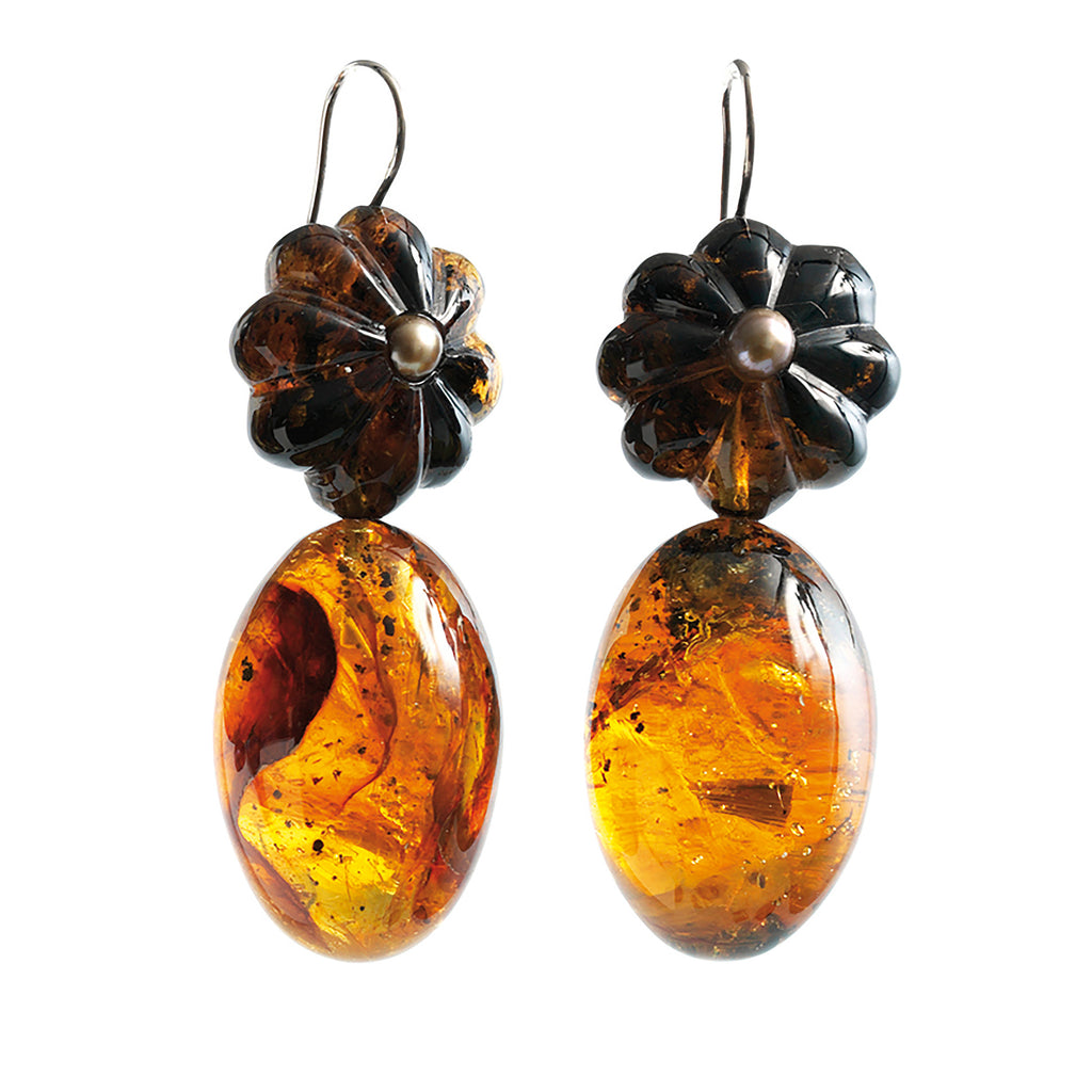 Oval shaped Dominican amber earrings with floral crowns.