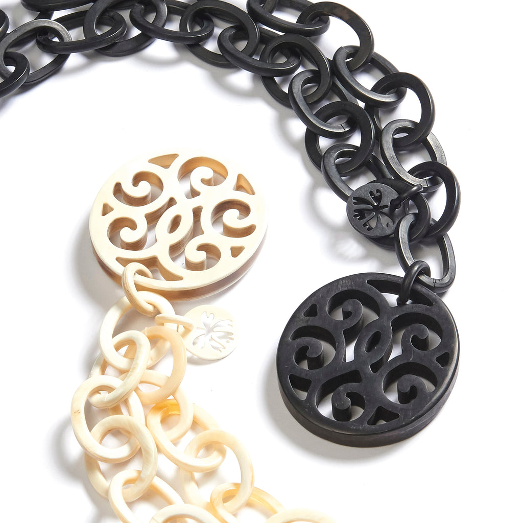 Vox necklaces: Thick ornament pendant in African and black mat buffalo horn on thick oval links necklace.