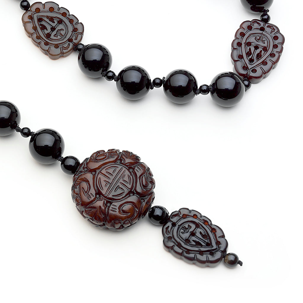 Gloria necklace: Onyx, carved Burma jade pendant and ornaments lariat.