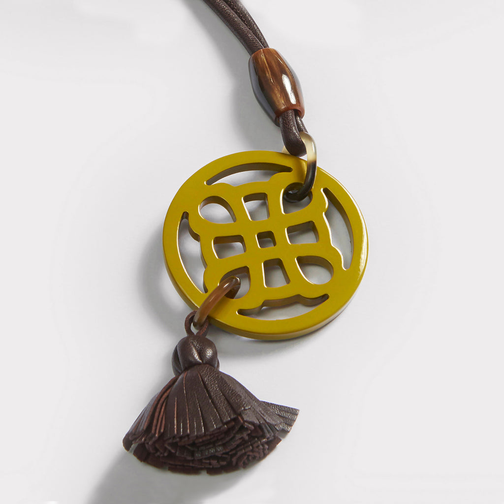 Orly necklace: Lacquered Gothic pendant in buffalo horn, Nappa tassel, adjustable Nappa cord.
