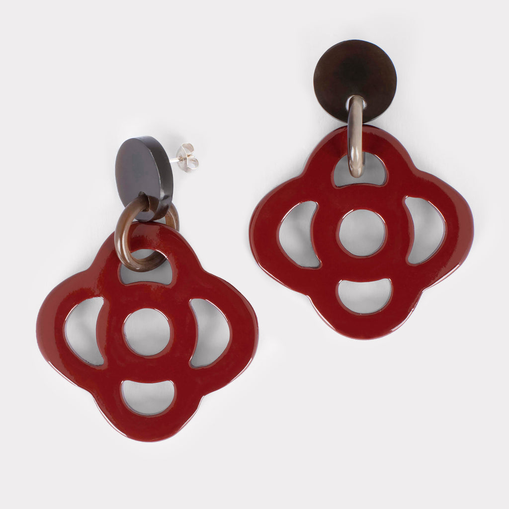 Thea earrings: Carved floral earrings in buffalo horn. Color: crimson.